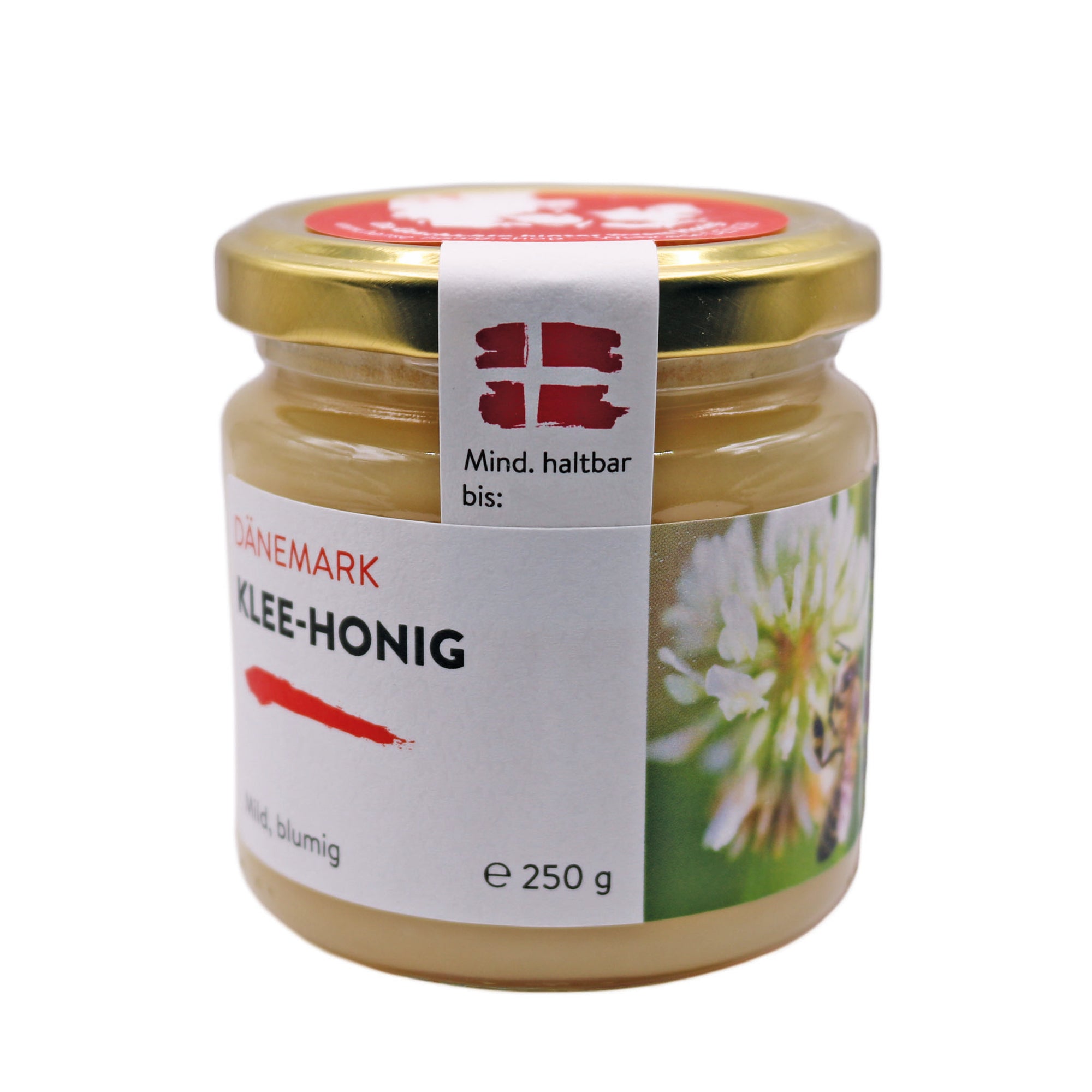 Ein Glas Dänischer Kleehonig 250g mit mildem und blumigem Geschmack, geerntet von den saftigen Weißklee-Wiesen der Ostseeinsel Møn. Perfekt als süße Ergänzung für Tee und Backwaren.