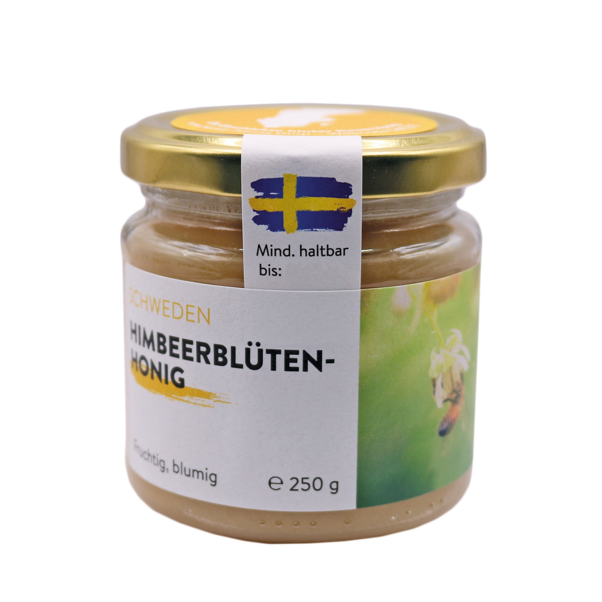 Ein Glas schwedischer Himbeerblütenhonig mit einem goldenen Deckel und einem Etikett, das eine Biene und eine Himbeerblüte zeigt. Der Honig stammt aus Schweden und hat ein mildes, fruchtig-blumiges Aroma.