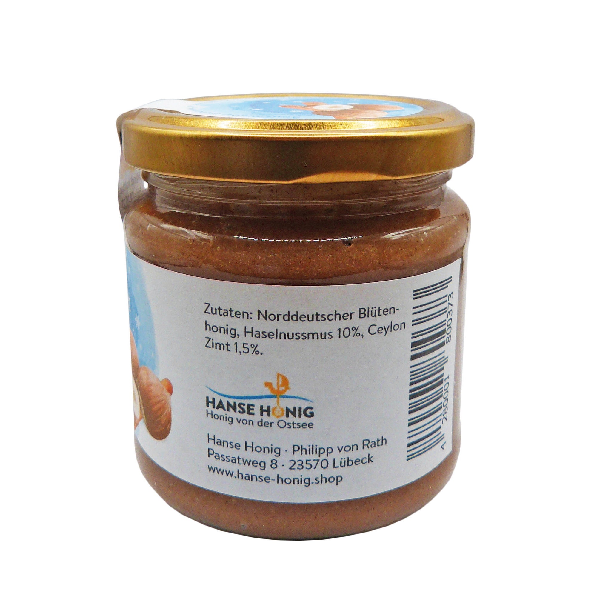 Glas Hanse Honig Winternougat, linke Seite Etikett – Blütenhonig mit Haselnussmus und Ceylon-Zimt, cremig gerührt, 250 g, handgemachte Winteredition.